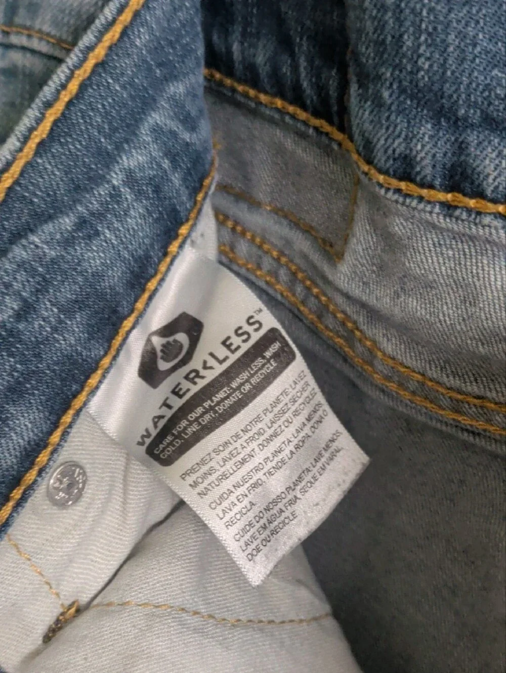 Levi's light blue denim jeans with tan leather patch